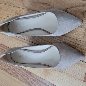 Cute low wedge pointed shoes .